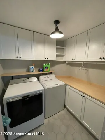 a utility room with washer and dryer