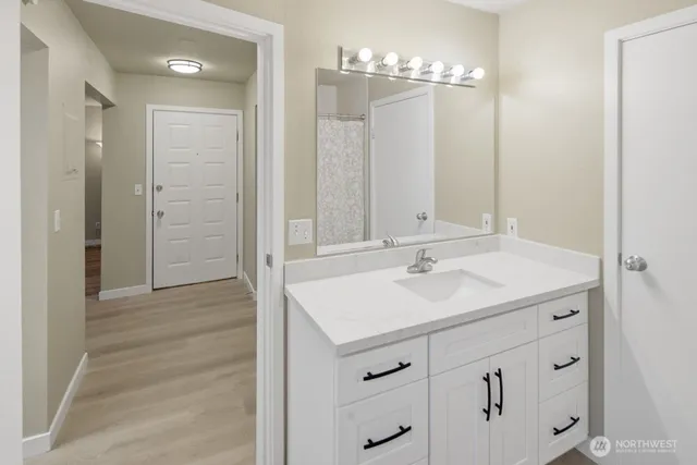 a bathroom with a sink and a mirror