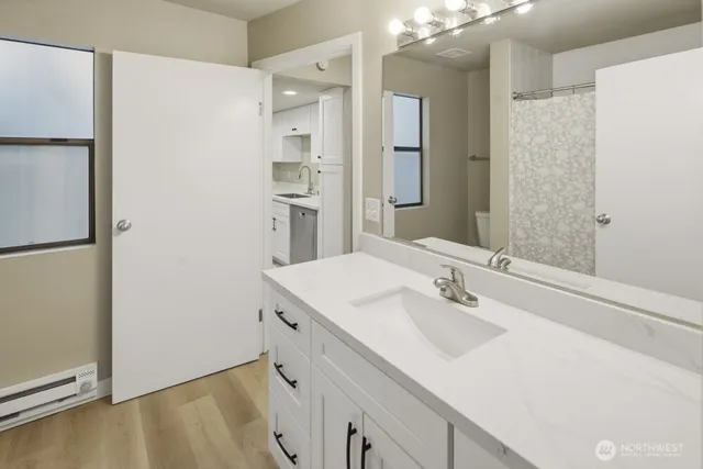 a bathroom with a sink and a mirror