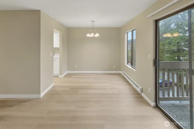 a view of an entryway with wooden floor