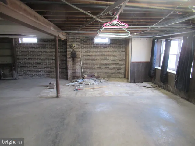 a view of empty room with wooden ceiling