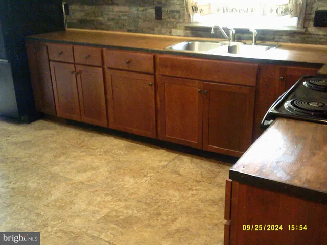 a view of a kitchen with wooden floor