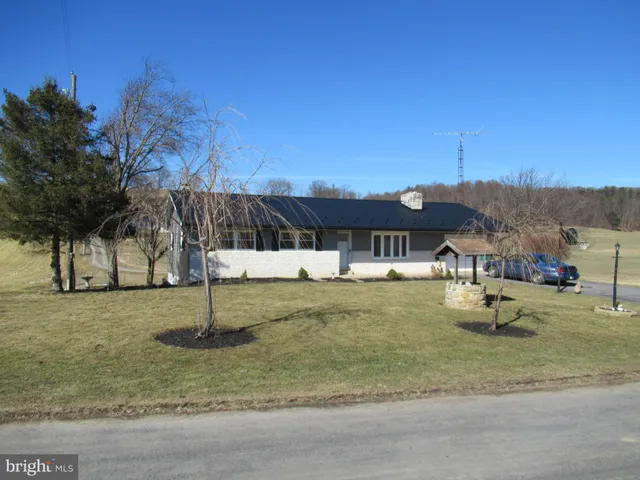 a swimming pool with some trees in the background