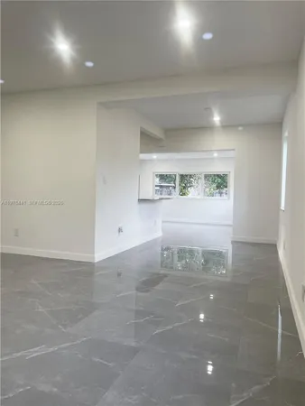 an empty room with windows and