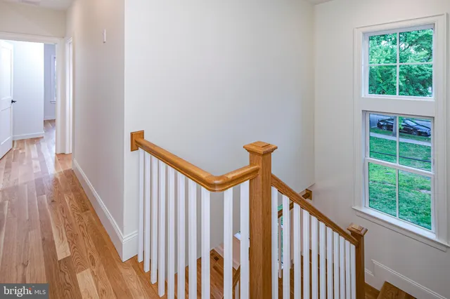a view of a balcony with wooden floor