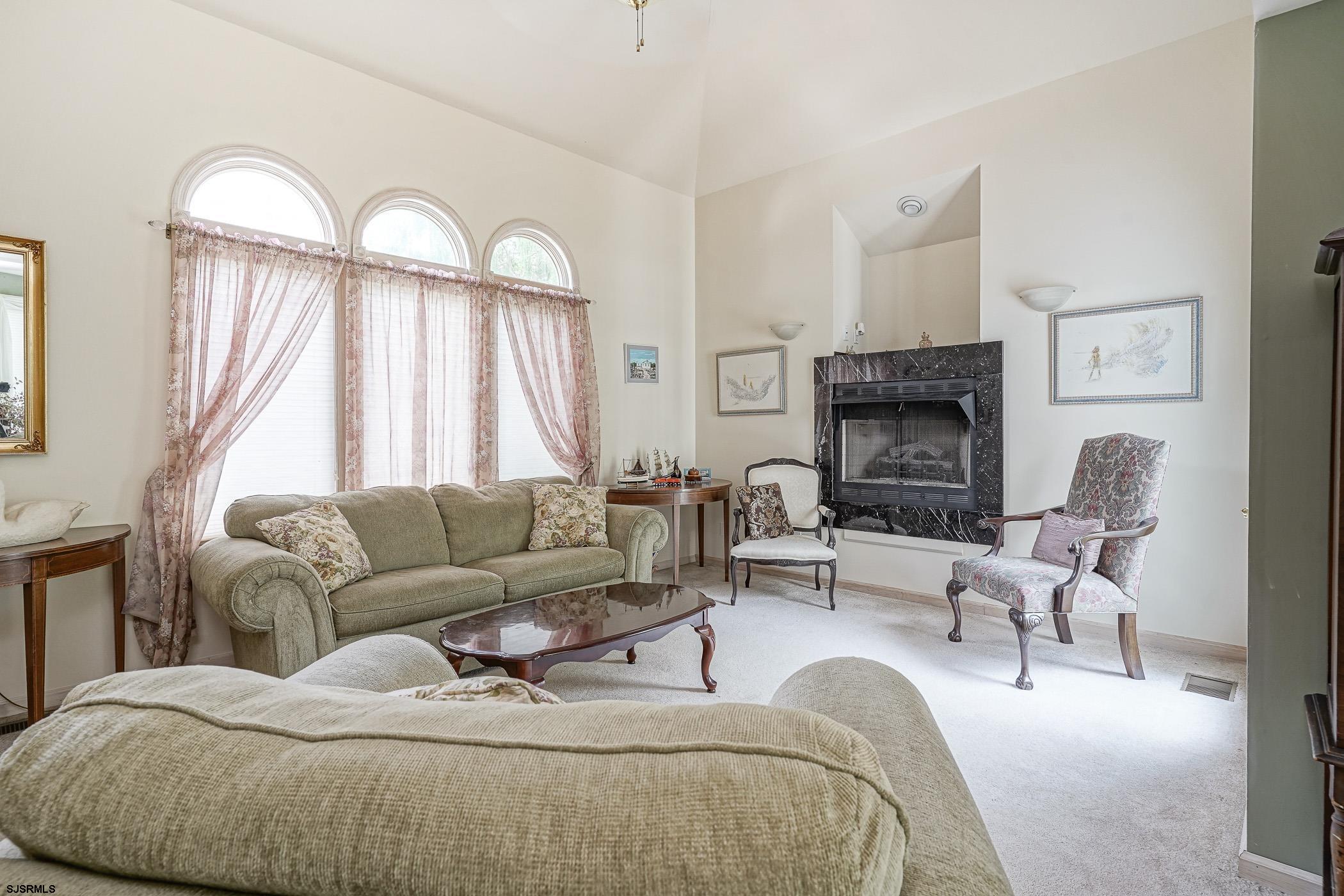 1099 Somers Point Road Egg Harbor Township, NJ 08234 - Photo 15 of 55 a living room with furniture a fireplace and a large window