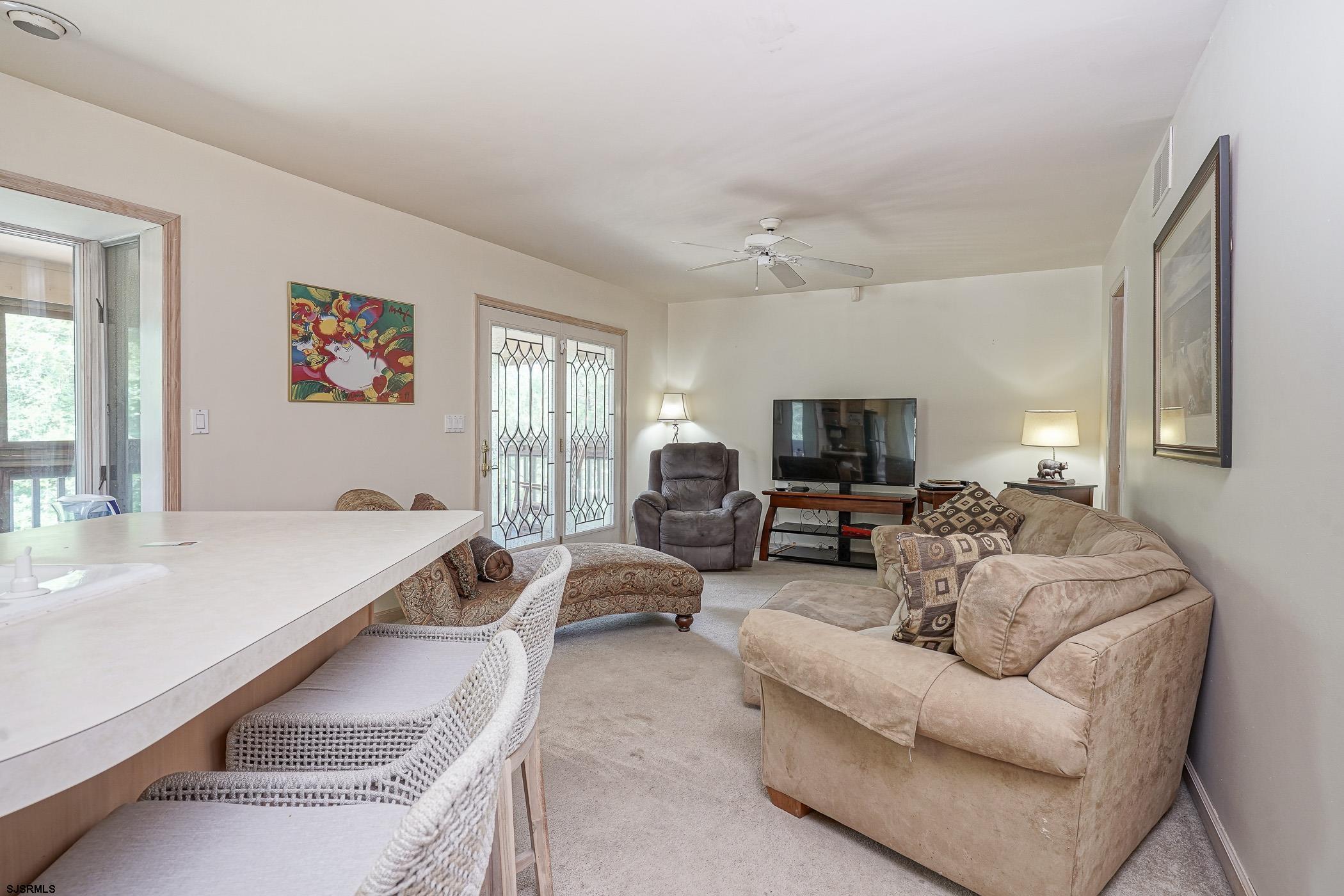 1099 Somers Point Road Egg Harbor Township, NJ 08234 - Photo 22 of 55 a living room with furniture and a flat screen tv