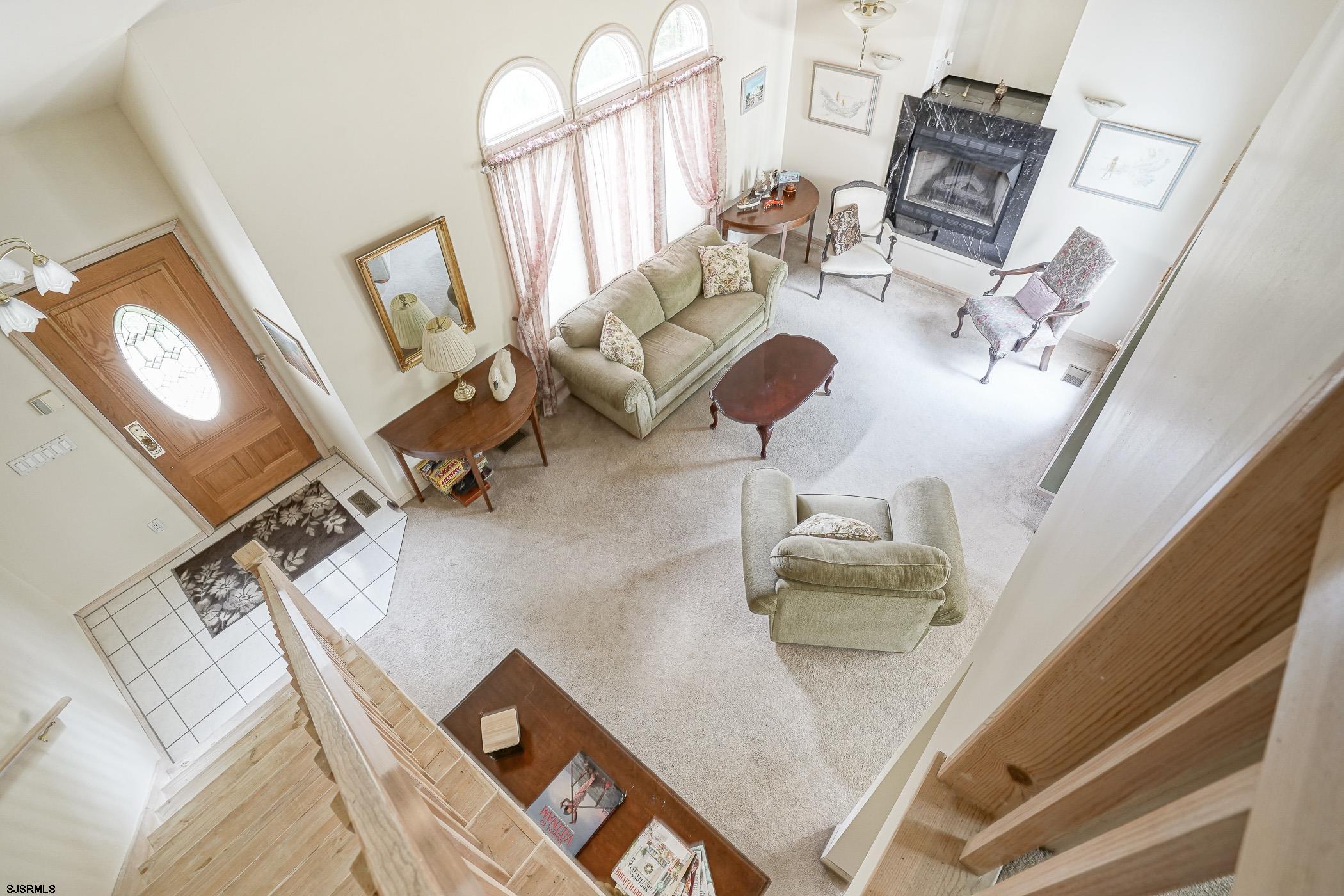 1099 Somers Point Road Egg Harbor Township, NJ 08234 - Photo 29 of 55 a living room with furniture and a chandelier