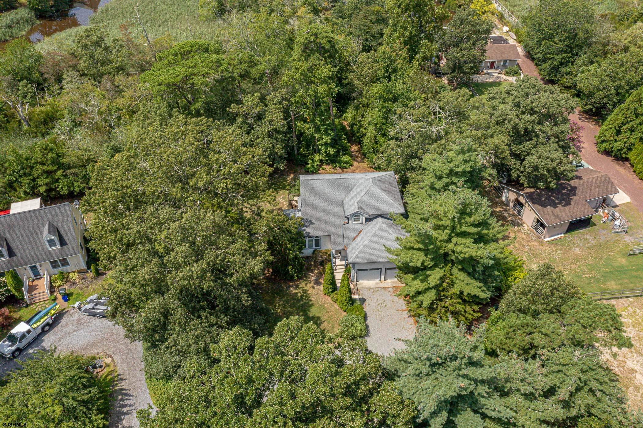 1099 Somers Point Road Egg Harbor Township, NJ 08234 - Photo 36 of 55 an aerial view of a house with a yard and lake view