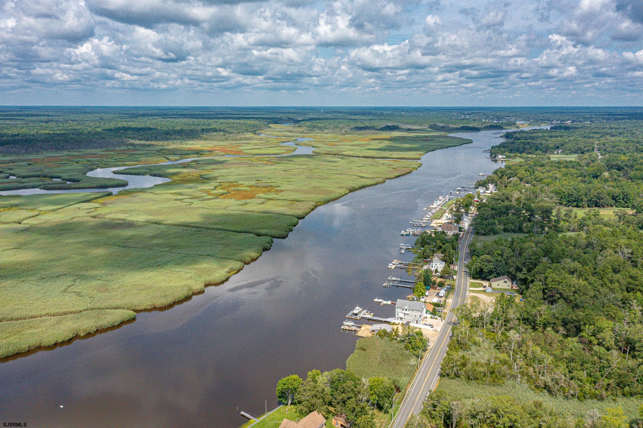 1099 Somers Point Road Egg Harbor Township, NJ 08234 - Photo 38 of 55 a view of a lake with a big yard