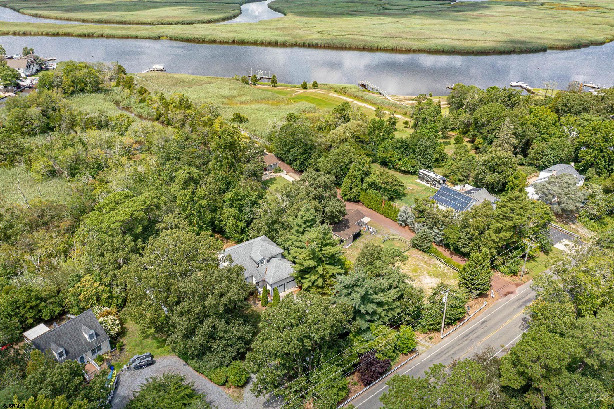 1099 Somers Point Road Egg Harbor Township, NJ 08234 - Photo 42 of 55 a view of a lake with a house