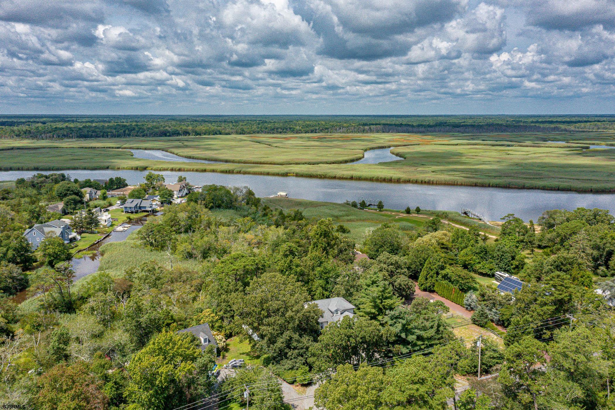 1099 Somers Point Road Egg Harbor Township, NJ 08234 - Photo 45 of 55 a view of a pathway both side of river and trees in the background