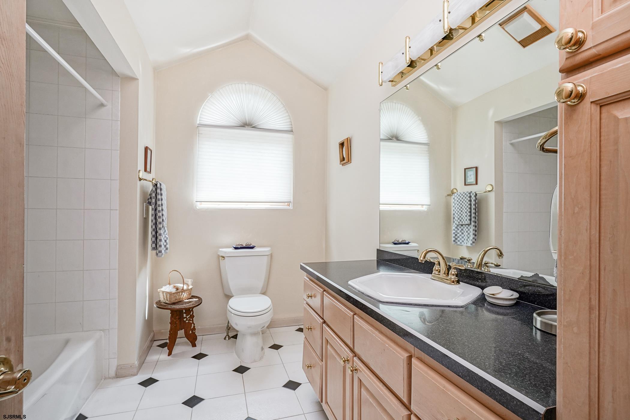 1099 Somers Point Road Egg Harbor Township, NJ 08234 - Photo 49 of 55 a bathroom with a sink a toilet and a mirror
