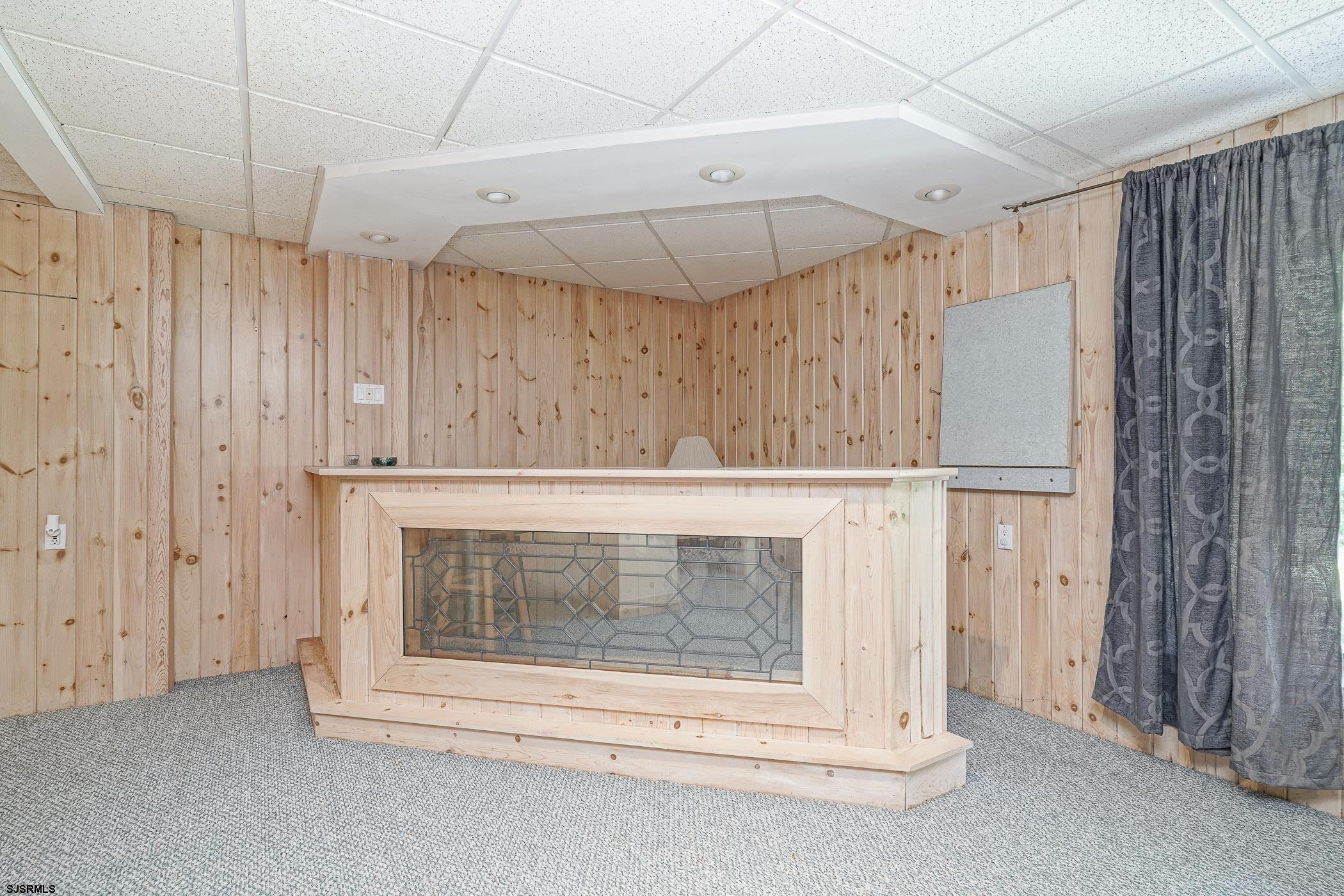 1099 Somers Point Road Egg Harbor Township, NJ 08234 - Photo 6 of 55 a room with a fireplace and a ceiling fan