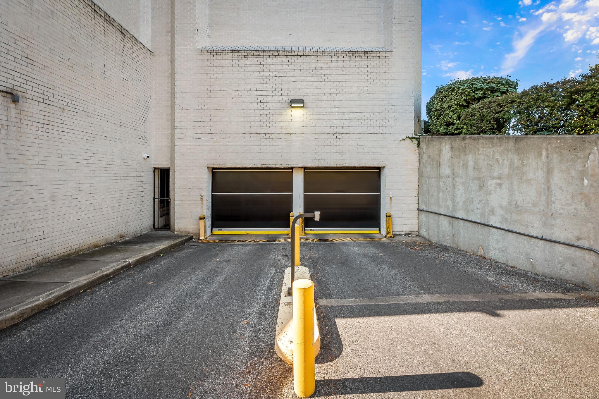 4001 Old Court Road, Unit 517 Baltimore, MD 21208 - Photo 11 of 38 a view of a wooden door and a yard