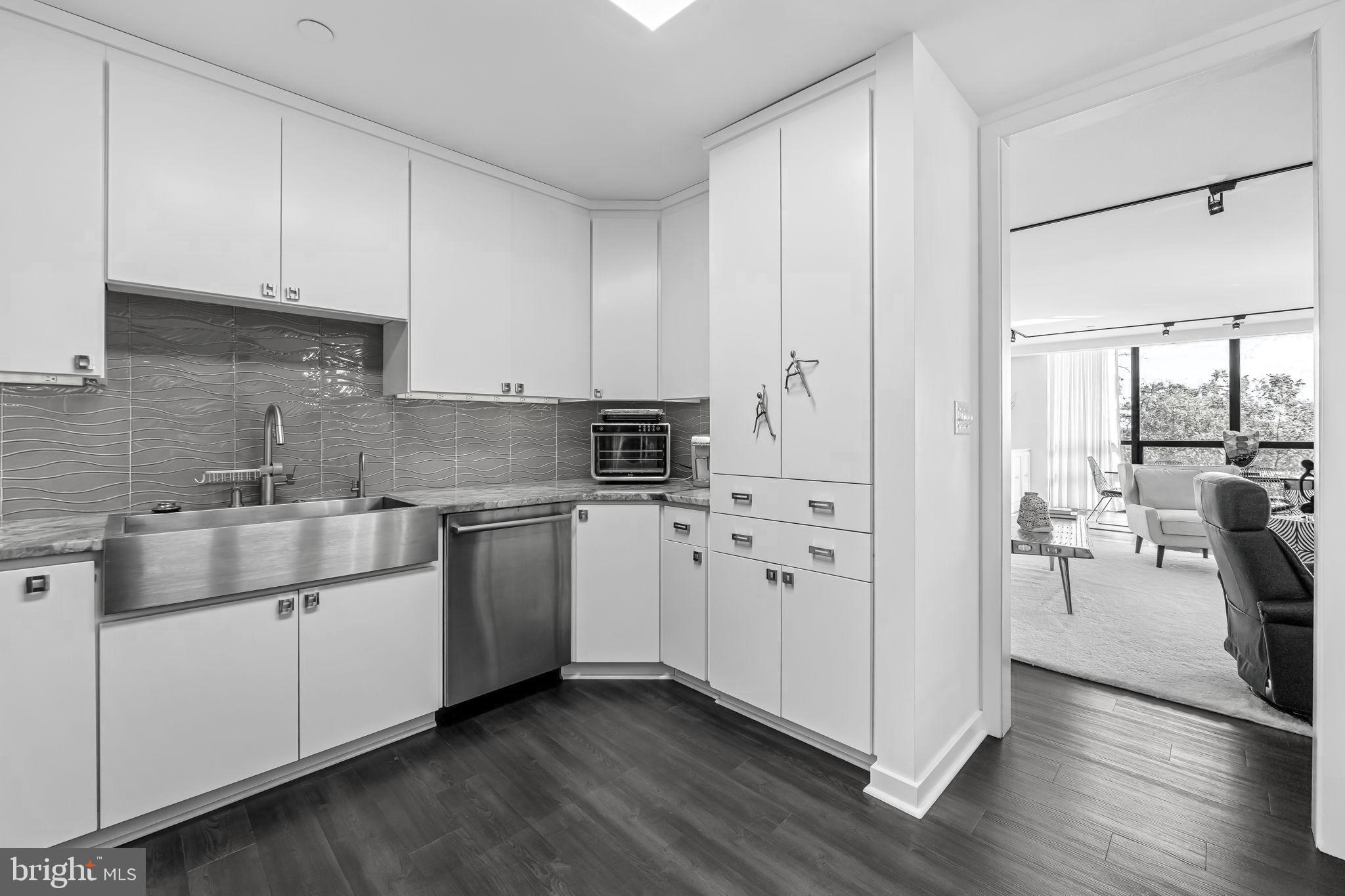 4001 Old Court Road, Unit 517 Baltimore, MD 21208 - Photo 15 of 38 a kitchen with stainless steel appliances white cabinets and a stove