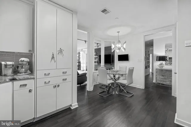 a view of a livingroom with furniture and a flat screen tv