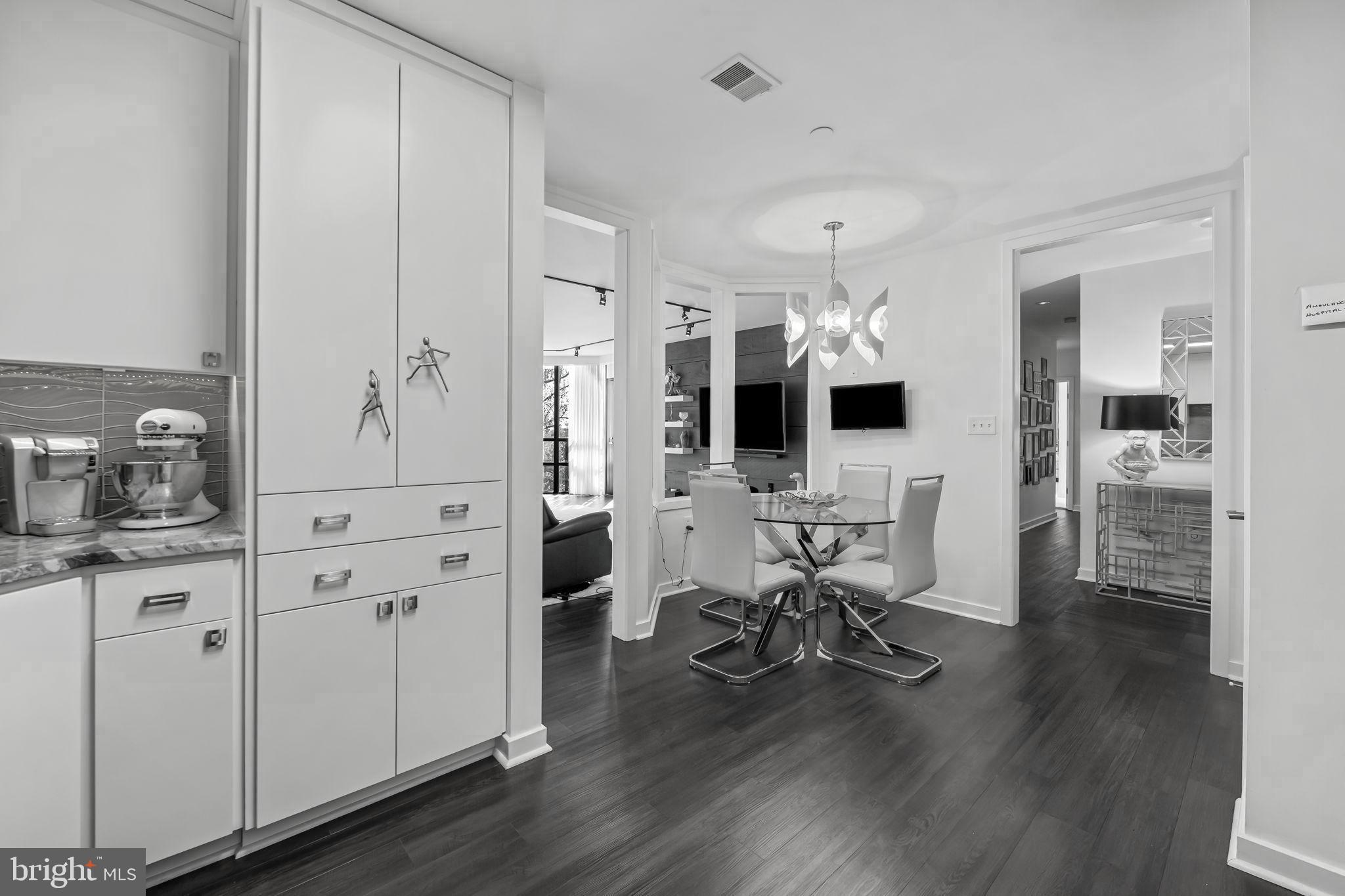 4001 Old Court Road, Unit 517 Baltimore, MD 21208 - Photo 16 of 38 a view of a livingroom with furniture and a flat screen tv