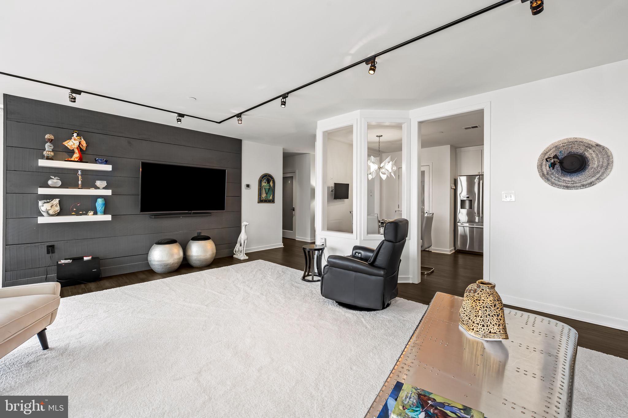 4001 Old Court Road, Unit 517 Baltimore, MD 21208 - Photo 20 of 38 a living room with furniture and a flat screen tv