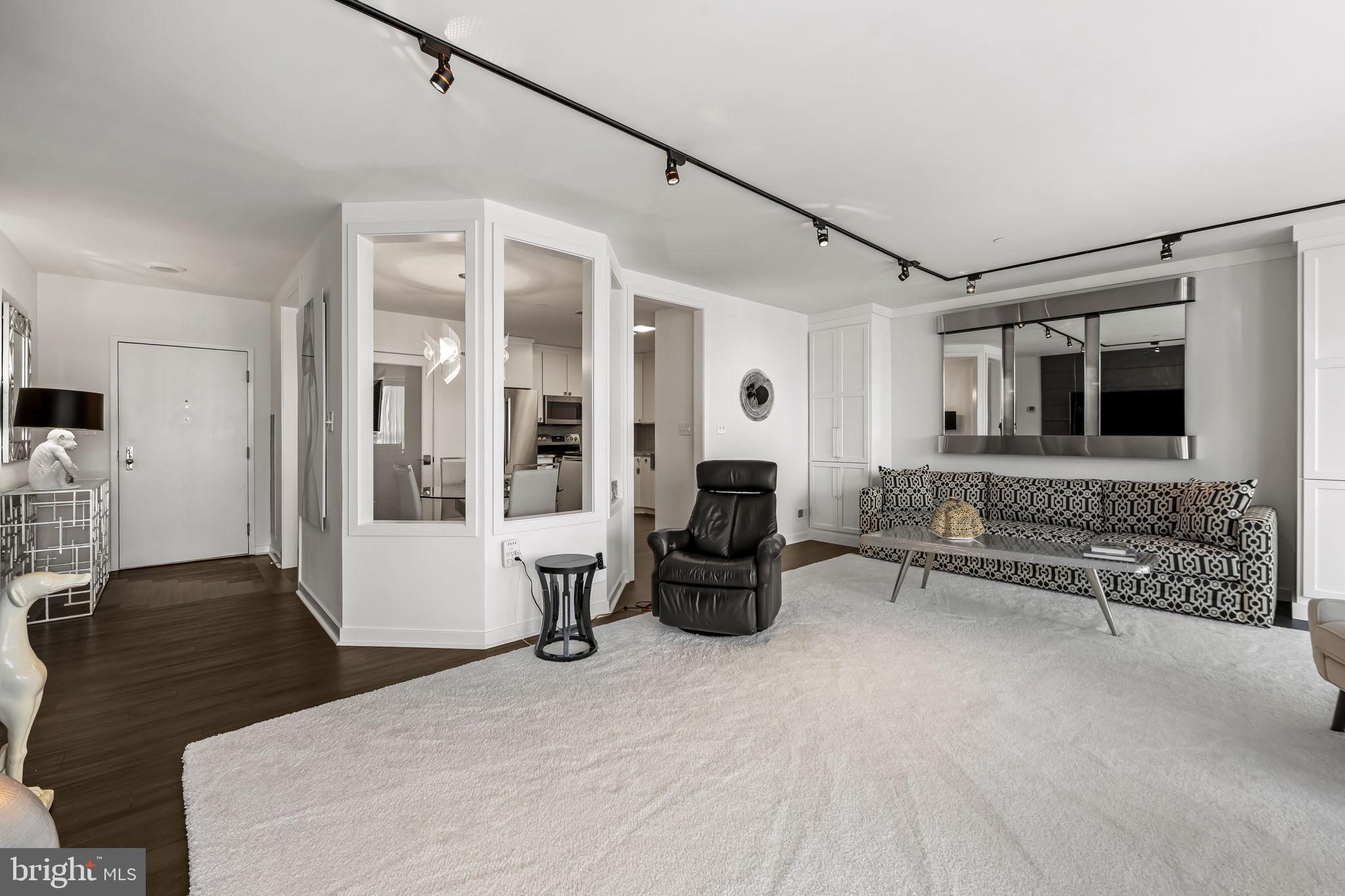 4001 Old Court Road, Unit 517 Baltimore, MD 21208 - Photo 22 of 38 a bedroom with furniture and a fireplace