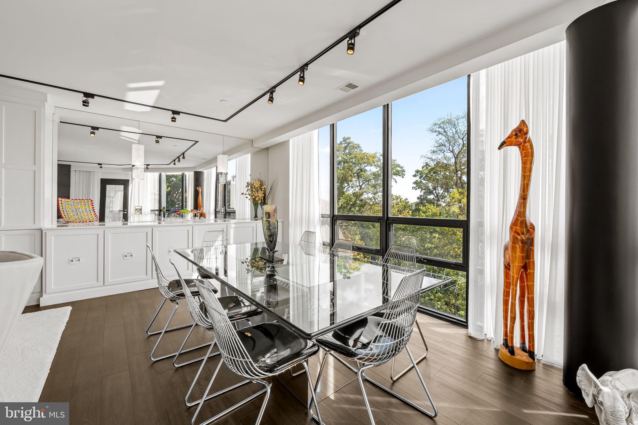 4001 Old Court Road, Unit 517 Baltimore, MD 21208 - Photo 23 of 38 a view of a dining room with furniture window and wooden floor