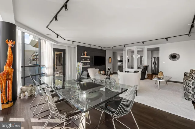 a view of a dining room with furniture window and wooden floor