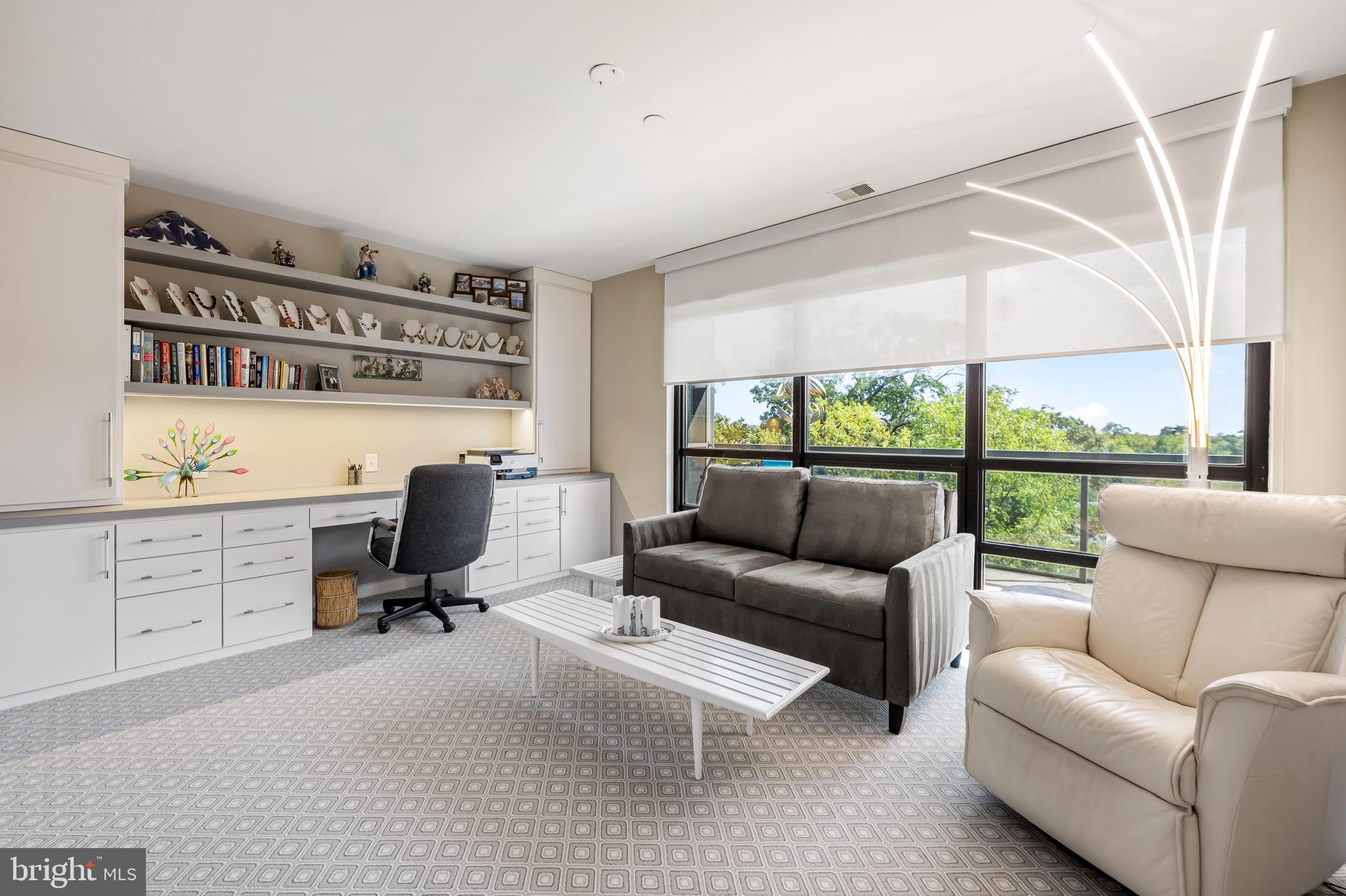4001 Old Court Road, Unit 517 Baltimore, MD 21208 - Photo 27 of 38 a view of a livingroom with workspace and a couch