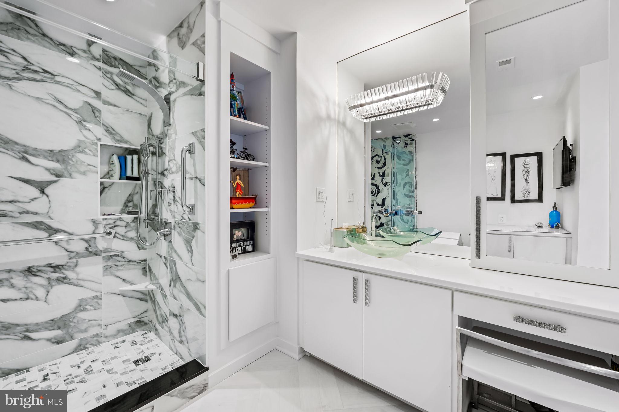 4001 Old Court Road, Unit 517 Baltimore, MD 21208 - Photo 30 of 38 a bathroom with a sink and a mirror