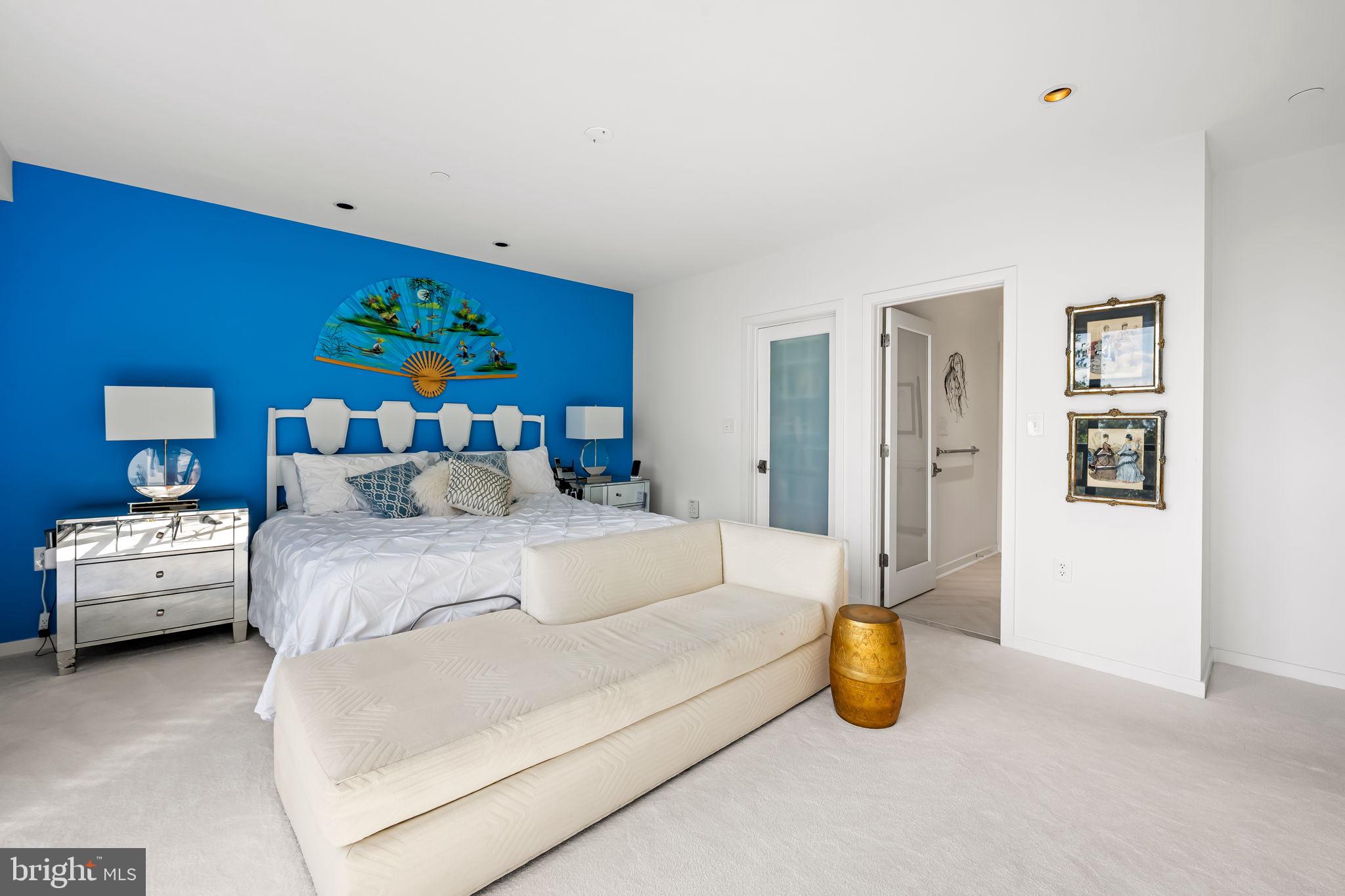 4001 Old Court Road, Unit 517 Baltimore, MD 21208 - Photo 32 of 38 a bedroom with furniture and a bed