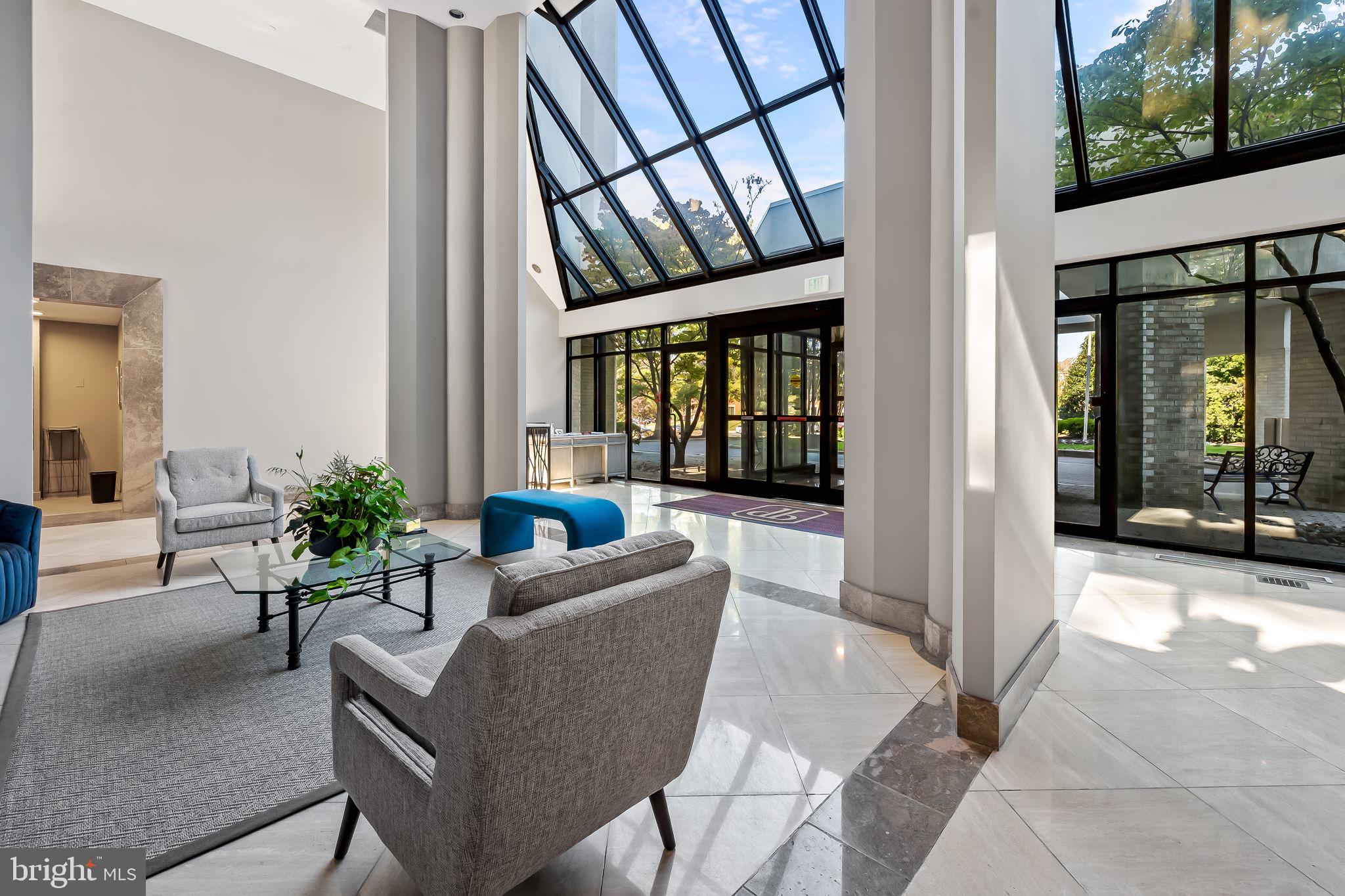 4001 Old Court Road, Unit 517 Baltimore, MD 21208 - Photo 5 of 38 a living room with furniture and a large window