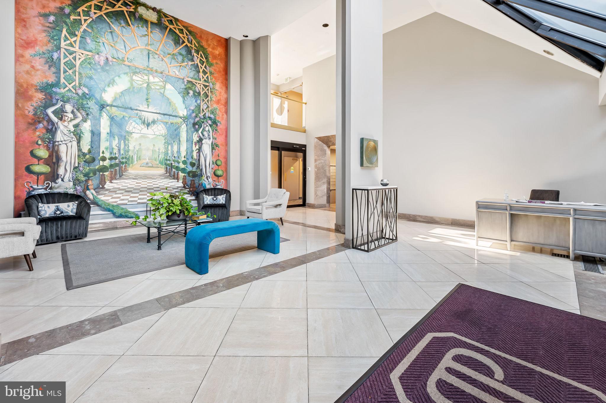 4001 Old Court Road, Unit 517 Baltimore, MD 21208 - Photo 6 of 38 a lobby with furniture and a potted plant