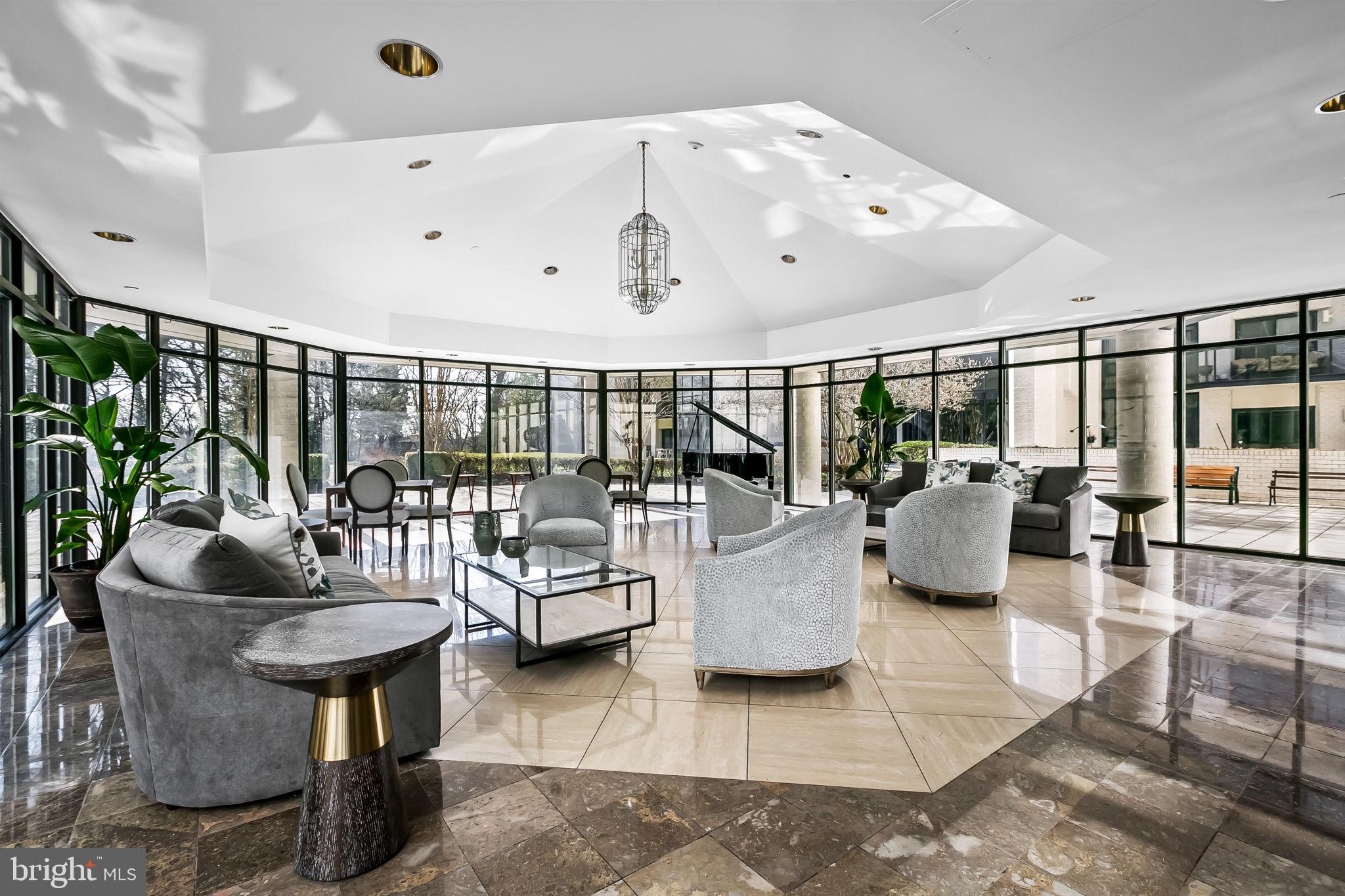 4001 Old Court Road, Unit 517 Baltimore, MD 21208 - Photo 7 of 38 a living room with furniture and a large window