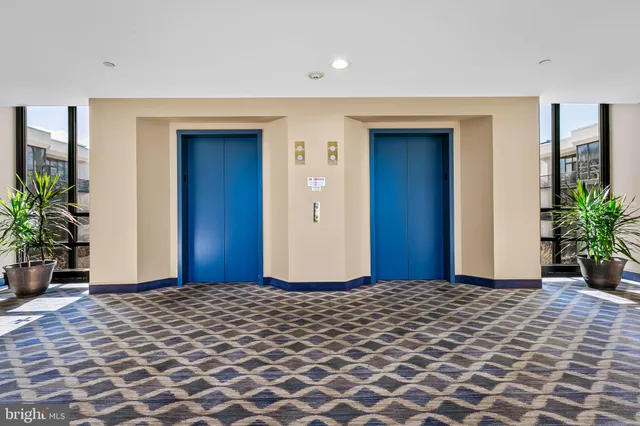 a bedroom with a bed and a potted plant