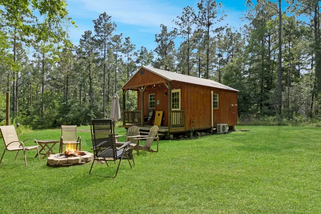 a view of a chair and table in front of a house