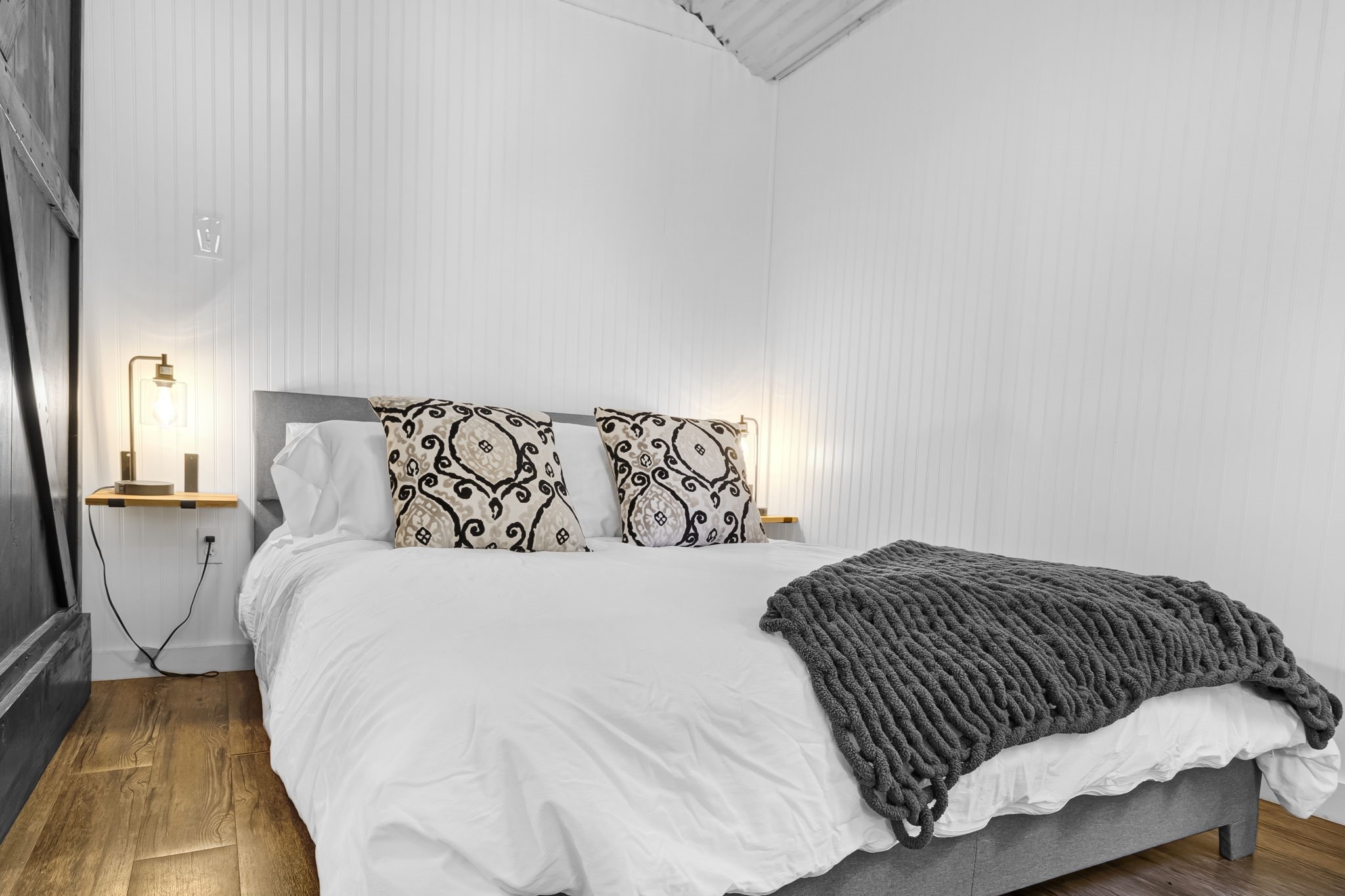 129 County Road 3160 Colmesneil, TX 75938 - Photo 19 of 40 Comfortable sleeping space with with built in tables and a TV on an adjustable mount to watch from bed or the couch.