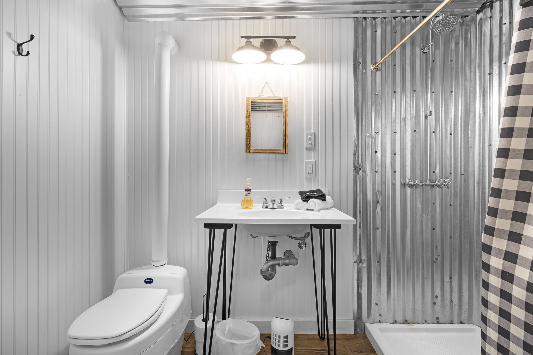 129 County Road 3160 Colmesneil, TX 75938 - Photo 22 of 40 Stylish and functional bathroom with modern plumbing and a composting toilet.