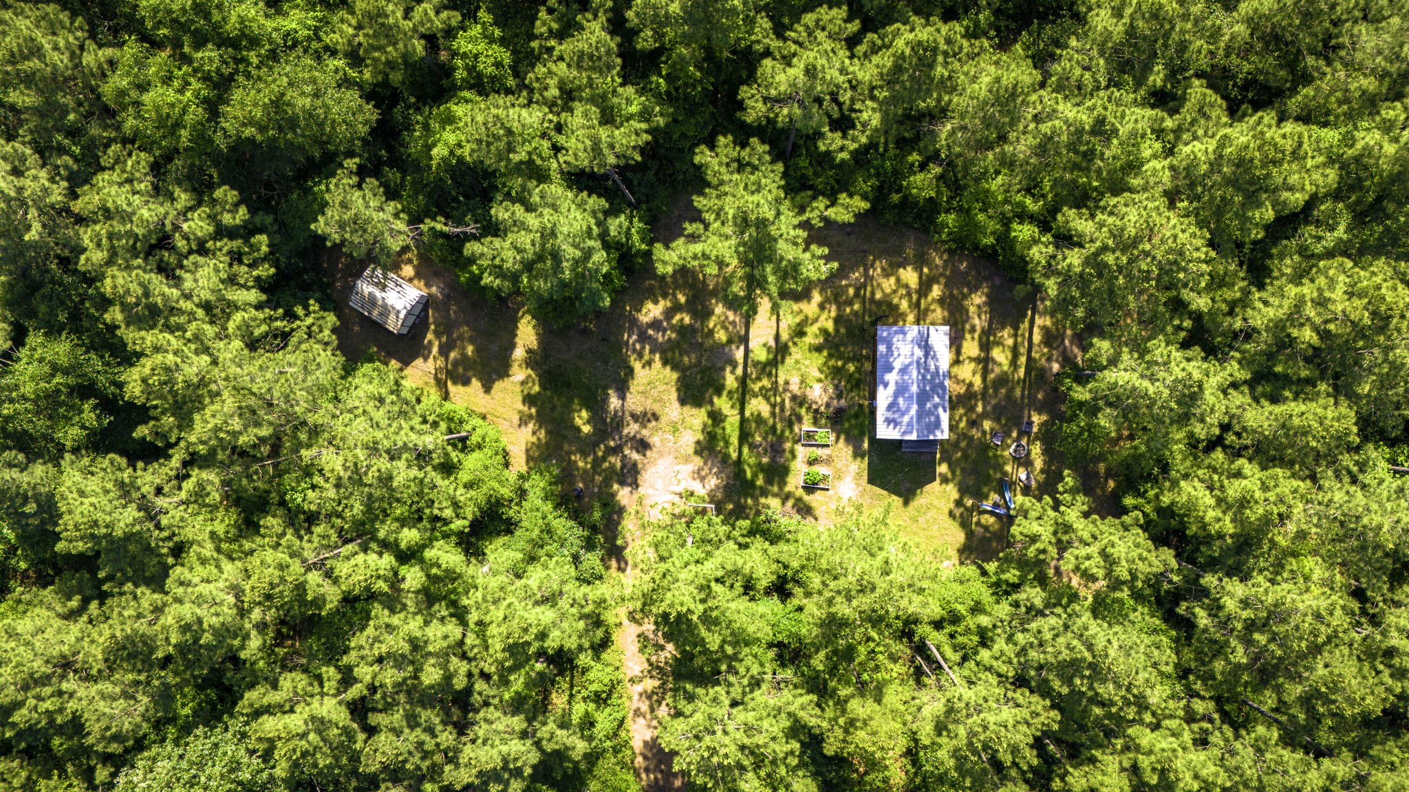 129 County Road 3160 Colmesneil, TX 75938 - Photo 28 of 40 West cabin and storage shed ariel.