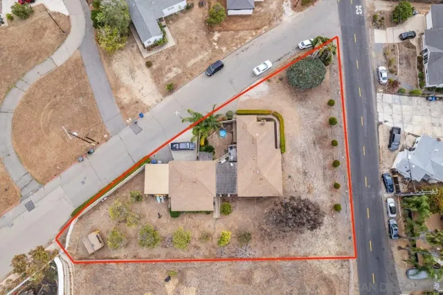 a view of house with outdoor space and sitting area