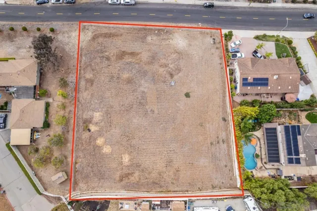 a front view of house with yard and trees