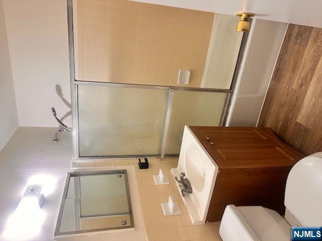 278 Main Street, Unit C3 Little Ferry, NJ 07643 - Photo 5 of 7 a bathroom with a sink toilet a mirror and shower