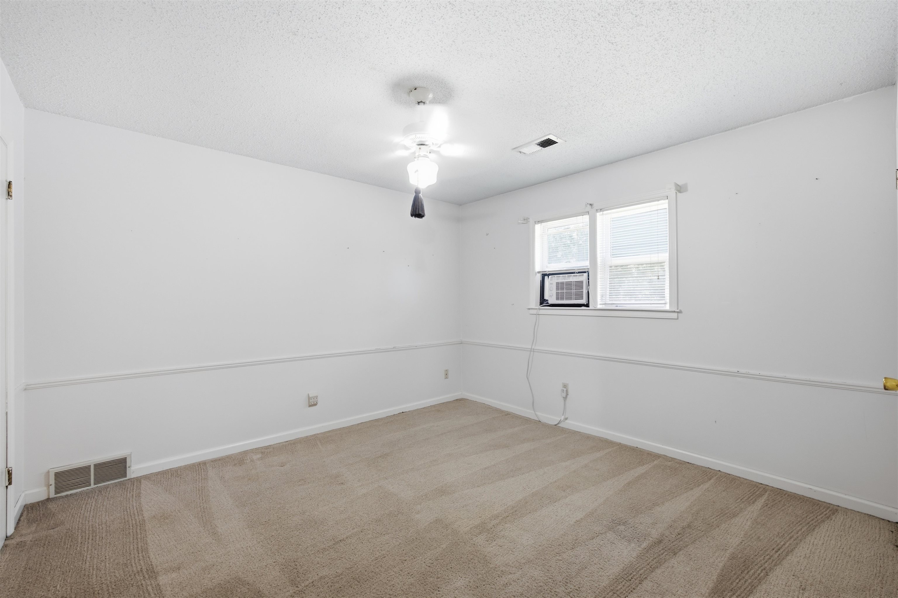 3007 Ruskin Road Bartlett, TN 38134 - Photo 21 of 37 Carpeted room featuring white walls, a ceiling fan, and two windows