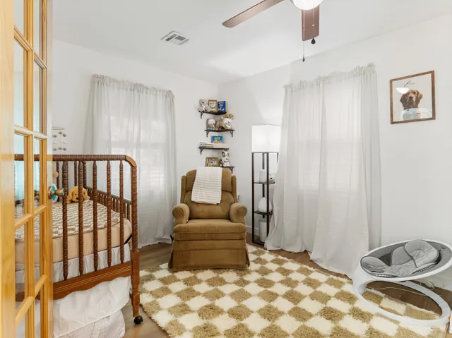 a kitchen with white cabinets stainless steel appliances and sink