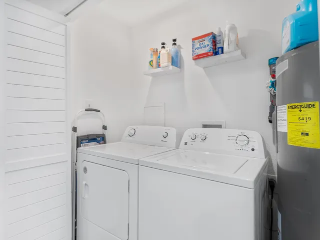a bedroom with a bed and a ceiling fan