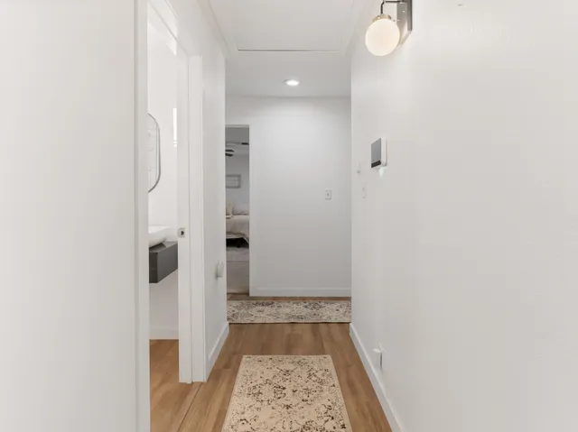 a bedroom with a bed dresser and a walk in closet