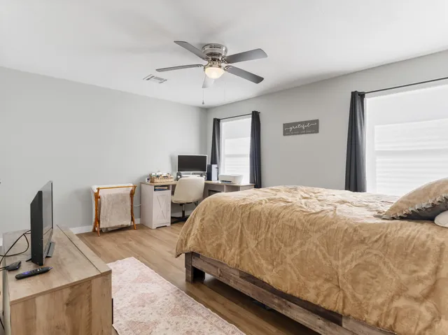 a view of a living room and floor to ceiling window or kitchen
