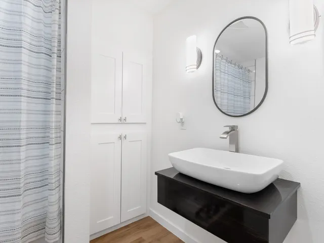 a view of a house with a yard and a garage