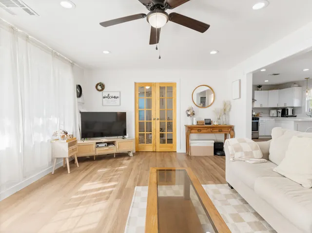 a kitchen with stainless steel appliances a stove a sink and a refrigerator