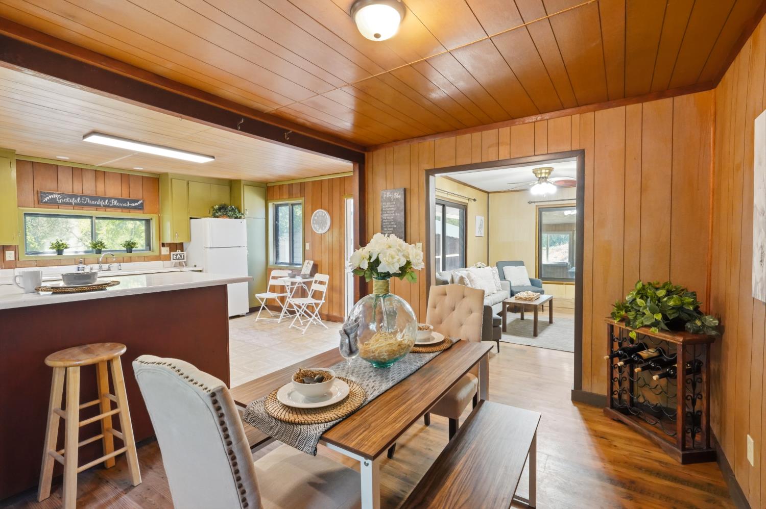 13351 Newtown Road Nevada City, CA 95959 - Photo 5 of 50 a view of a dining room with furniture window and wooden floor