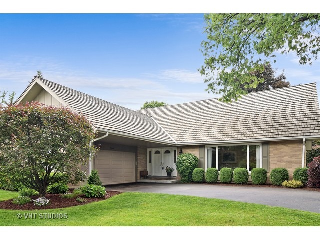 2 Old Valley Road Rolling Meadows, IL 60008 - Photo 1 of 17 a front view of a house with a yard and potted plants
