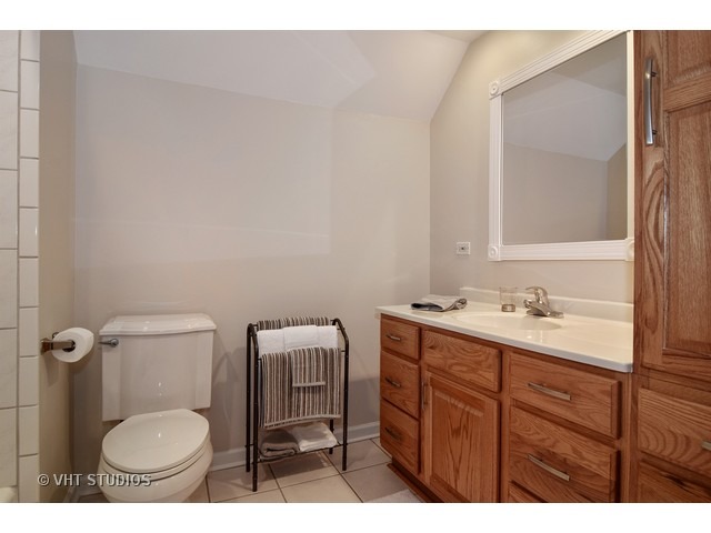 2 Old Valley Road Rolling Meadows, IL 60008 - Photo 14 of 17 a bathroom with a toilet a sink and mirror